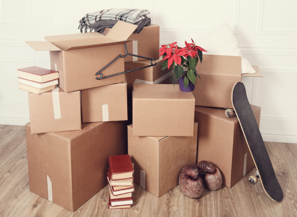 Moving home. Cardboard boxes on the floor